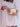 Person holding an Elyse & i gold Otis handbag with a white background