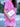 Person wearing a pink dress with white embroidery, holding a silver leather bag by Elyse & i called Otis shell.