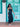 Elyse & i Theo Knot shoulder bag carried by model in black dress.