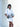 Model in white outfit wearing a crossbody bag by Elyse & i called Theo Knot.