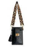 Black Elyse & i Luna Lock handbag with a leopard print strap on a white background