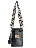 Black Luna Lock by Elyse & i handbag with zebra-striped strap on a white background