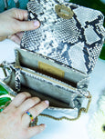 Inside view of the monochrome snake print 'Otis' handbag by Elyse & i