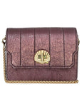 Metallic shimmery Otis bag by handbag brand Elyse & i with gold chain and shell emblem on a white background