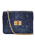 Elyse & i blue snakeskin patterned Otis bamboo turn lock handbag with a gold chain and clasp on a white background