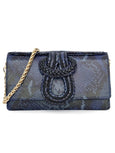 Blue snakeskin patterned Elyse & i Nell Knot calf leather handbag with gold chain strap on a white background