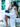 Woman in a white dress sitting on a bench with a blue Elyse & i Nell Knot clutch