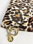 Elyse & i Bella Purse Scallop Leopard print clutch with gold chain and pendant on a white background
