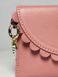 Pink Bella Purse wallet by Elyse & i with a keychain on a light gray background