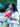 Woman holding a red Elyse & i Finn Scallop handbag outdoors with blurred background