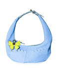 Light blue Martha Hobo handbag with a yellow butterfly charm on a white background