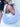 Woman holding a light blue Martha hobo handbag by Elyse & i with floral straps against a blurred background