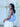 Woman holding a light blue Martha handbag by Elyse & i in an outdoor setting