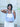 Woman holding a light blue Martha hobo handbag by Elyse & i with a blurred background