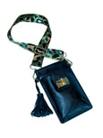 Elyse & i Luna Lock black handbag with a green camouflage strap on a white background