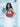 Woman holding a terracotta Elyse & i Martha hobo handbag in front of a white door