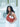 Woman holding a brown Elyse & i Martha hobo bag with a patterned strap against a white background