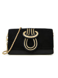 Elyse & i Nell Knot bag, in black and gold leather, seen with chain strap.