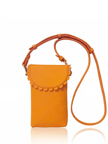 Orange crossbody bag with scalloped edge on a white background