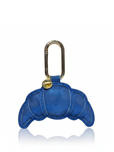 Blue crab-shaped keychain with a gold carabiner on a white background