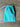 Turquoise drawstring pouch with 'Elyse & i' branding on a wooden surface