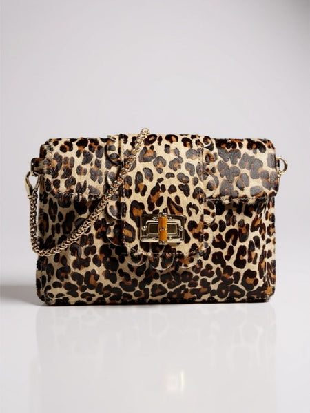 Leopard print handbag with a gold chain on a white background