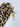 Leopard print phone case with a gold charm on a white background