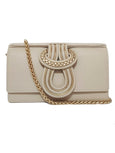 Beige handbag with gold chain strap on a white background