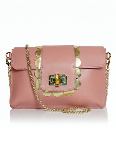 Pink handbag with gold accents on a white background