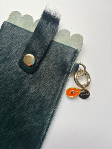 papaya charm on a glasses case