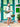 Woman holding a green handbag in front of a colorful door