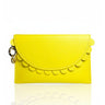 Yellow clutch bag with scalloped edge on a white background