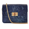 Elyse & i blue snakeskin patterned Otis bamboo turn lock handbag with a gold chain and clasp on a white background
