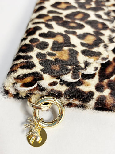 Elyse & i Bella Purse Scallop Leopard print clutch with gold chain and pendant on a white background