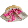Clutch bag with pink bow and metallic finish on a white background - the Dawn Scallop by Elyse & i in silver croc embossed leather