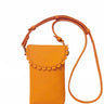 Orange crossbody bag with scalloped edge on a white background