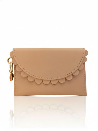 Beige flap wallet with scalloped edge on a white background
