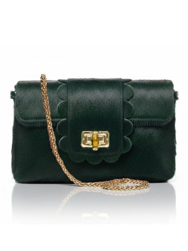 Green handbag with scalloped edge design and gold chain strap on a white background