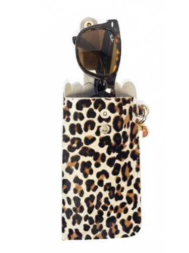 Leopard print sunglasses case with sunglasses inside on a white background