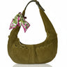 Green suede handbag with a floral scarf on a white background