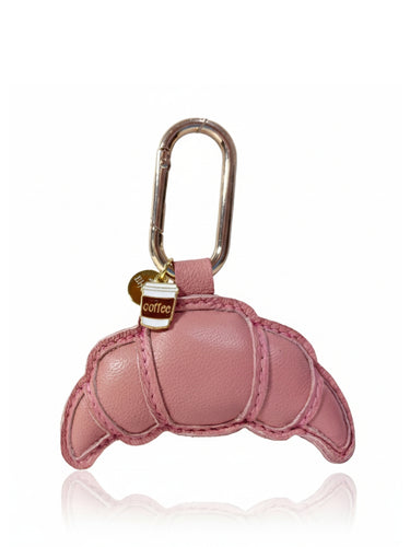 Pink butterfly-shaped keychain with a carabiner on a white background