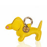 Yellow dog-shaped keychain with a gold tag on a white background