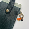 papaya charm on a glasses case