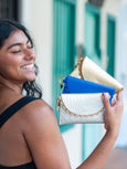 Woman holding three Bella purses by Elyse & i on the street

