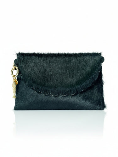 Green fur clutch bag with gold accents on a white background