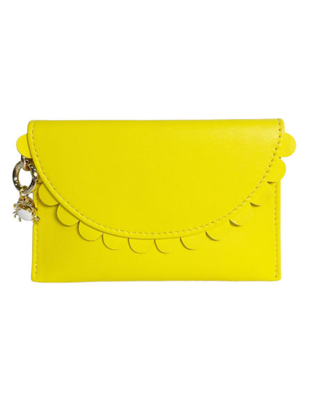 Yellow Bella Purse by Elyse & i wallet with scalloped edge and decorative charm on a white background
